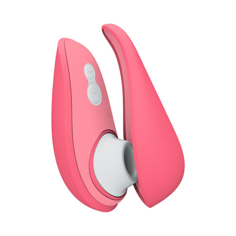 Womanizer Liberty 2 Clitoral Suction Toy in Rose. A palm-sized, teardrop shaped toy with a rounded tip. on the front of the larger end there is a white silicone piece with an oval hole which sticks out. There are two white buttons below this.