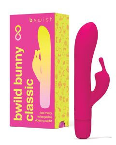 Bwild Classic Bunny Dual Stimulation Rabbit Vibrator in Sunset Pink. A slim shaft with a shorter rabbit head shaped arm protruding from near the base. Single button control the on bottom end.