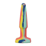 A Play 4" Groovy Silicone Anal Plug in Multicolor/Yellow. A narrow orange, blue, yellow and green swirl butt plug with a tapered, rounded tip and rectangular flared base
