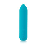 Je Joue Classic Bullet Vibrator in purple. A small bullet shaped vibe with soft tip. Has a removable matching silicone finger sleeve. Three button controls  on the side, near the bottom. A silicone flap covers the charging port on the bottom end.