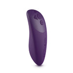 We-Vibe Chorus couple’s vibrator in purple. A small, adjustable, horseshoe shaped toy with one end slightly larger than the other. One button control on the larger end. Remote control has 4 buttons.