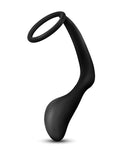 Anal Adventures Cock Ring + Plug. Cock ring with an oval shaped but plug attached by a roughly 3 inch thick silicone cord. Black.