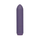 Je Joue Classic Bullet Vibrator in teal. A small bullet shaped vibe with soft tip. Has a removable matching silicone finger sleeve. Three button controls  on the side, near the bottom. A silicone flap covers the charging port on the bottom end.