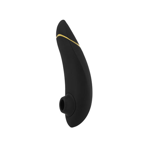 Womanizer Premium clitoral suction toy in black. A teardrop shaped toy with a silicone cap with an oval hole, which sticks out of the inside of the toy near the round end. Two button controls on the back side.