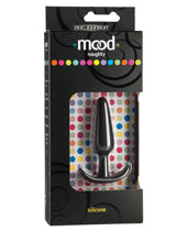 A black and multicolored polkadot box with a small black butt plug with tapered tip, slim neck, and curved flared base