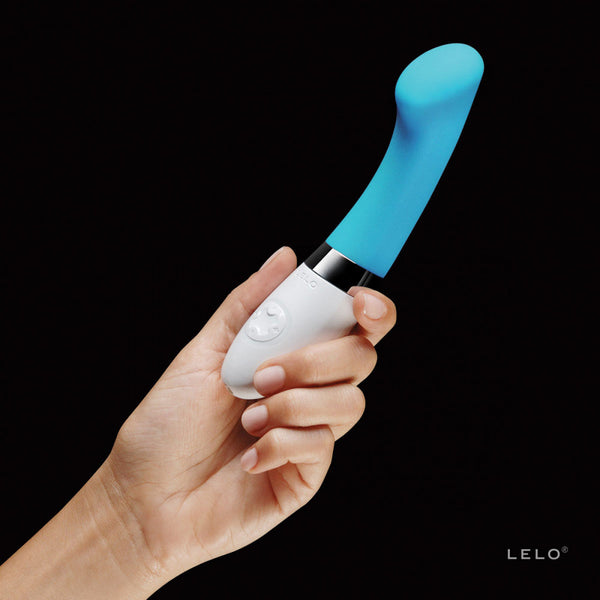 Lelo Gigi 2 g-spot vibrator in turquoise. A shortish, slim shaft with a curved, flat head. The bottom third is a white handle with button controls.