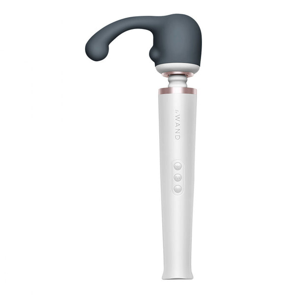 Le Wand Curve Massager Attachment. A round hollow cap in dark gray with a slim, smooth shaft with a slightly bulbous tip, coming out of the top left of the cap. There’s a small bump on the bottom left for clitoral stimulation.