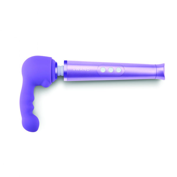 Le Want Petite Ripple Massager Attachment. A round hollow cap in purple with a slim, ribbed shaft with a slightly bulbous tip, coming out of the top left of the cap.