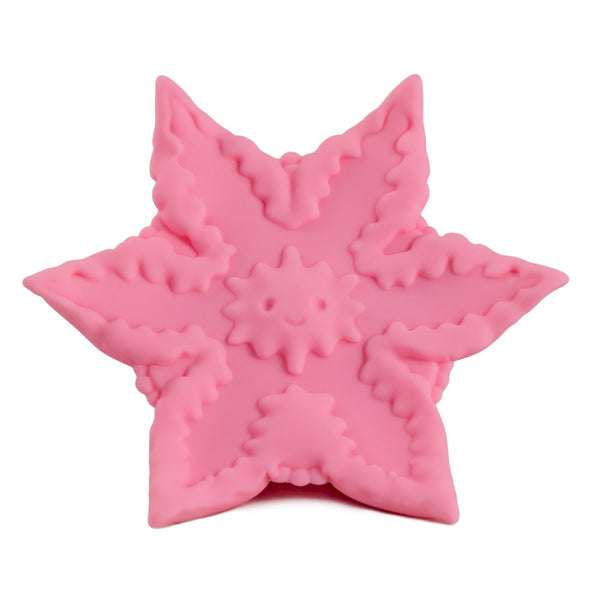 Starsi vibrator in rose. A concave, hand-sized vibrator in the shape of a starfish, with starfish face on inside curve.