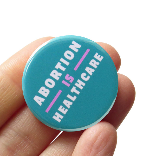 ABORTION IS HEALTHCARE Button l Social Justice Pin
: Carded + Sleeved