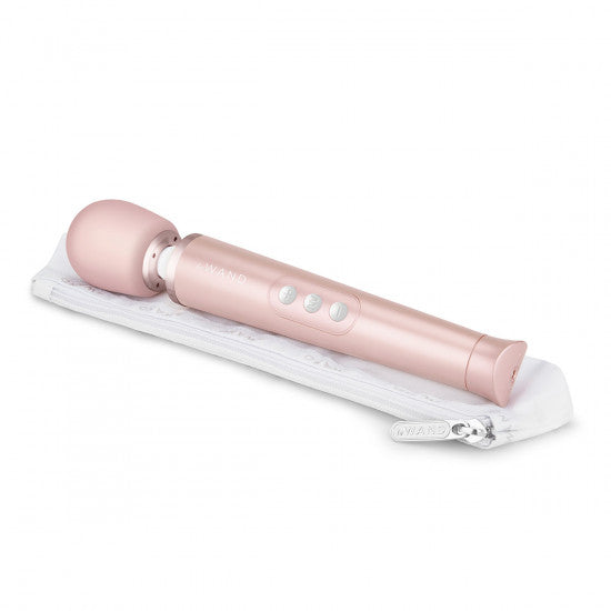 Le Wand Petite massager in rose gold. A long, wide handle, slim flexible neck and rounded head. Three button controls in the middle of the handle. 