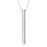 Crave Vesper necklace vibrator. A very slim silver pendant vibrator on a silver colored chain necklace.