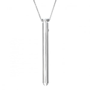 Crave Vesper necklace vibrator. A very slim silver pendant vibrator on a silver colored chain necklace.