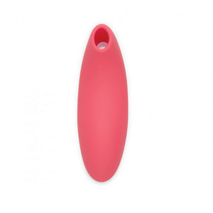We-Vibe Melt in midnight blue. A 5 inch long toy with rounded edges and a curved tip with oval shaped hole for clitoral suction. in the middle of the toy are two button controls.